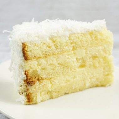 savor the classic flavor of a traditional coconut cake slice at Mia's Bakery.