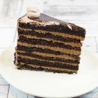 savor the classic flavor of a traditional chocolate layer cake slice at Mia's Bakery.