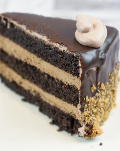 savor the classic flavor of a homemade chocolate mousse cake slice at Mia's Bakery.