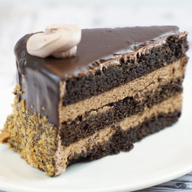 savor the classic flavor of a homemade chocolate mousse cake slice at Mia's Bakery.