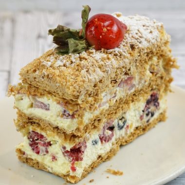 savor the classic flavor of a traditional napoleon cake slice at Mia's Bakery.