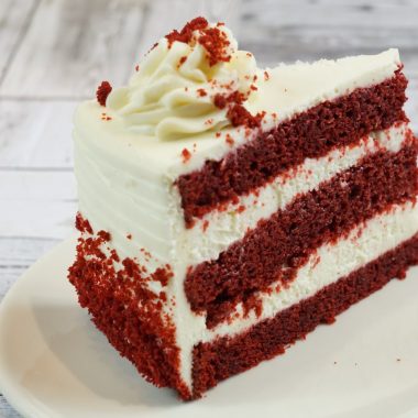 savor the classic flavor of a traditional red velvet cake slice at Mia's Bakery.