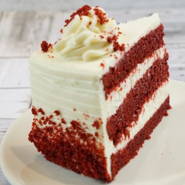 savor the classic flavor of a traditional red velvet cake slice at Mia's Bakery.