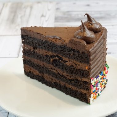 savor the classic flavor of a homemade chocolate fudge cake slice at Mia's Bakery.