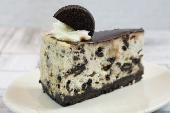 savor the classic flavor of a traditional oreo cheesecake slice at Mia's Bakery.