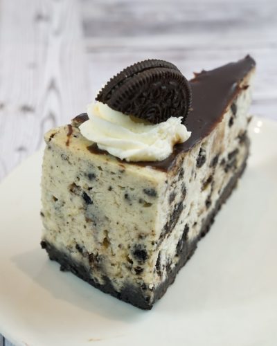 savor the classic flavor of a traditional oreo cheesecake slice at Mia's Bakery.