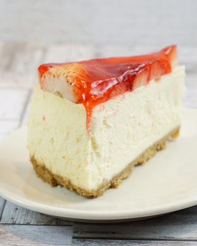 savor the classic flavor of a traditional strawberry cheesecake slice at Mia's Bakery.