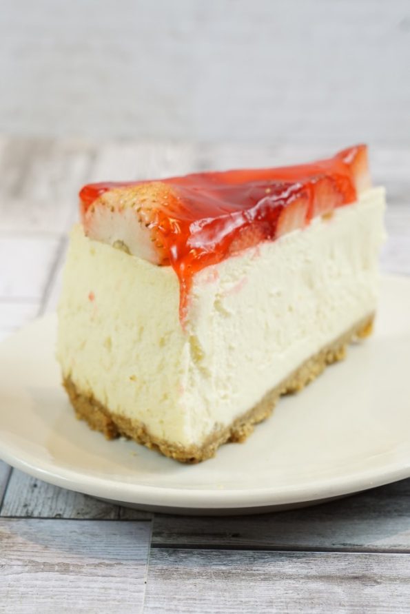 savor the classic flavor of a traditional strawberry cheesecake slice at Mia's Bakery.