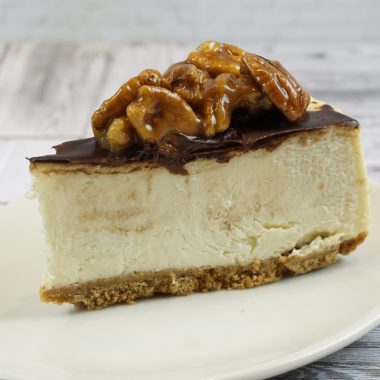 savor the classic flavor of a traditional New York style pecan pie cheesecake slice at Mia's Bakery.