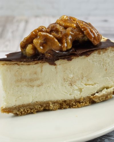 savor the classic flavor of a traditional New York style pecan pie cheesecake slice at Mia's Bakery.