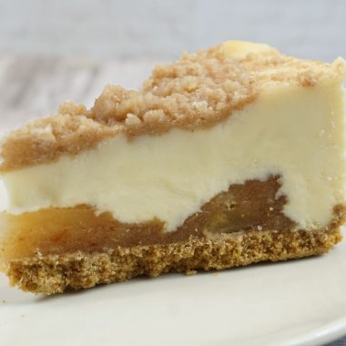 savor the classic flavor of a traditional New York style apple cheesecake slice at Mia's Bakery.