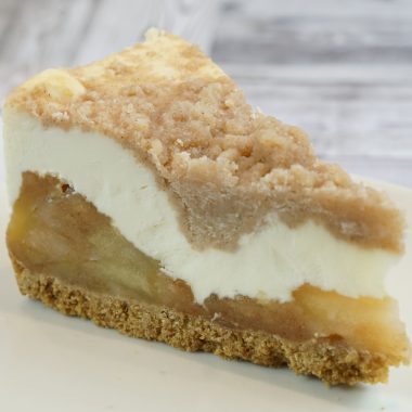 savor the classic flavor of a traditional New York style apple cheesecake slice at Mia's Bakery.