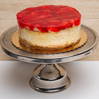 savor the classic flavor of a traditional strawberry cheesecake at Mia's Bakery.