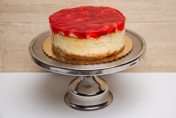 savor the classic flavor of a traditional strawberry cheesecake at Mia's Bakery.