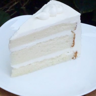 savor the classic flavor of a traditional vanilla bean cake slice at Mia's Bakery.
