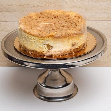 savor the classic flavor of a traditional New York style apple cheesecake at Mia's Bakery.