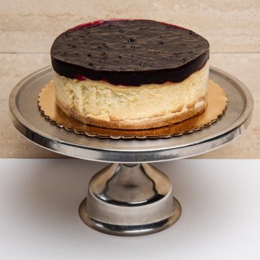 savor the classic flavor of a New York style blueberry cheesecake at Mia's Bakery.