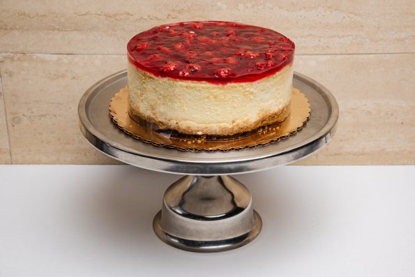 savor the classic flavor of a traditional New York style cherry cheesecake at Mia's Bakery.