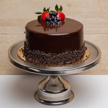 savor the classic flavor of a traditional chocolate layer cake at Mia's Bakery.