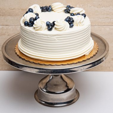savor the classic flavor of a traditional lemon blueberry cake at Mia's Bakery.