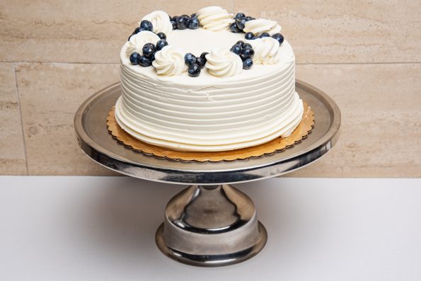 savor the classic flavor of a traditional lemon blueberry cake at Mia's Bakery.