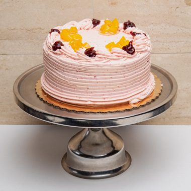 savor the classic flavor of a traditional peach raspberry cake at Mia's Bakery.
