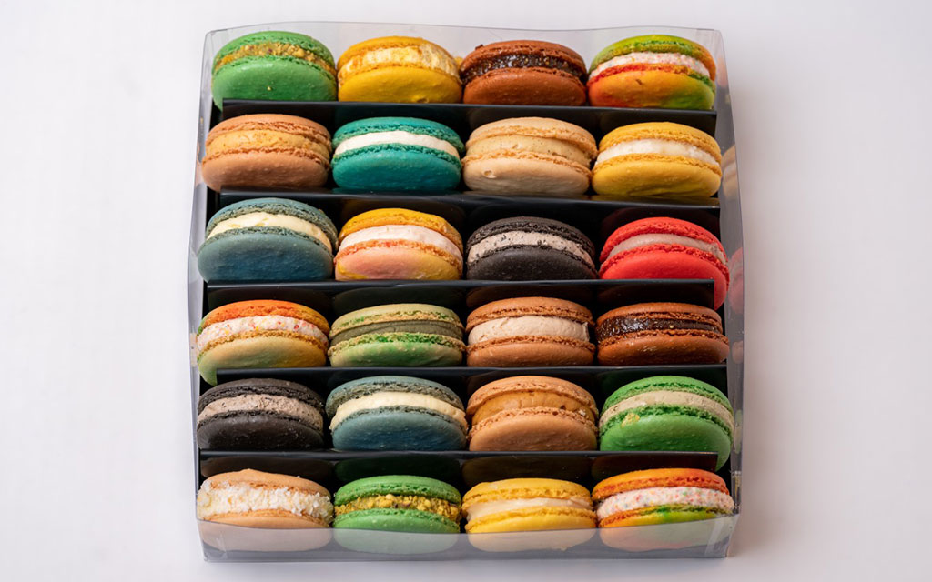 Mother's Day dessert ideas with assorted colorful macarons in a gift box