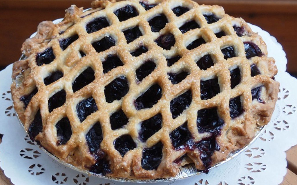 Classic blueberry pie with lattice crust as traditional 4th of July dessert ideas for summer gatherings