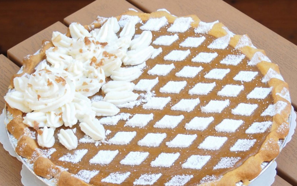 Sweet potato pie with lattice crust and whipped cream, Southern fall dessert idea