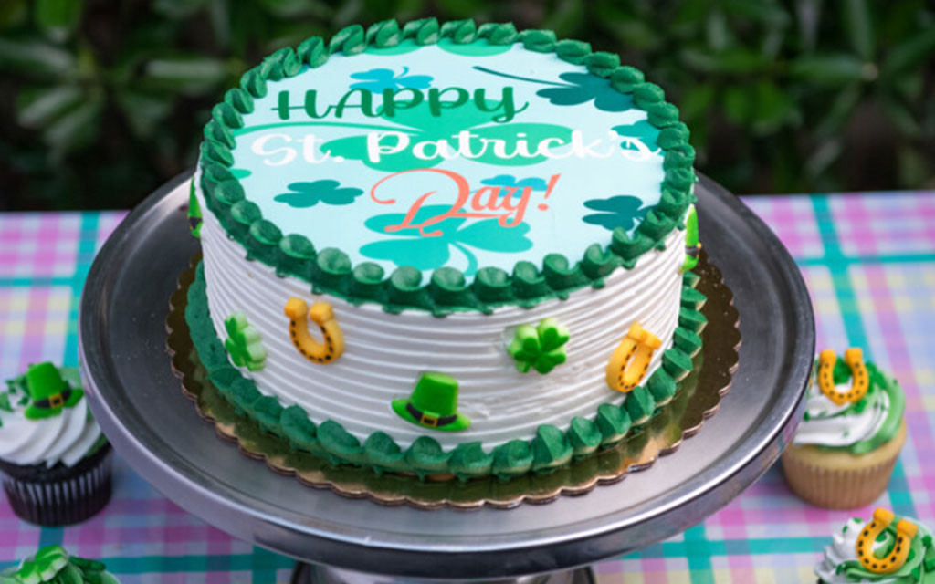 Seasonal desserts for St. Patrick's Day featuring green and white cake with shamrocks, horseshoes, and festive decorations