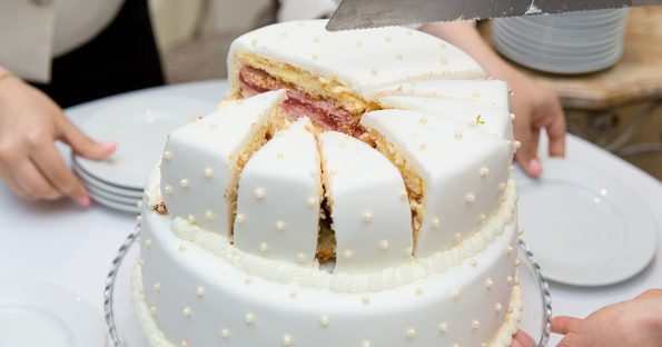 Wedding cake flavors guide showing two-tier cake with visible vanilla layers and berry filling
