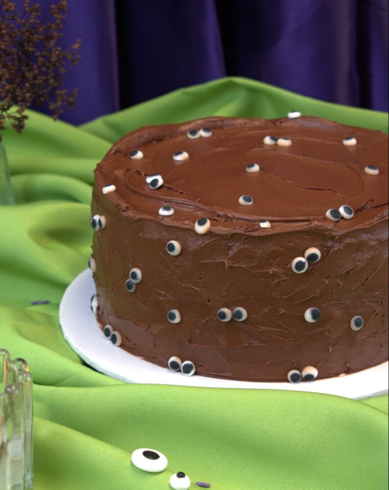 Eyeball Cake, Mia's Bakery Round chocolate Halloween cake in swirled chocolate frosting covered with candy eyeballs, Mia's Bakery