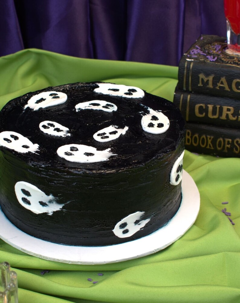 Ghosts Cake, Mia's Bakery Round Halloween cake in black frosting with little white ghosts on the top and sides, Mia's Bakery